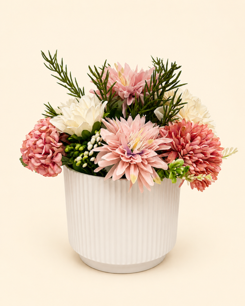 Floral arrangement in a white pot on a beige background